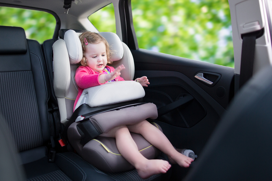 bigstock-Little-Girl-In-Car-Seat-80408453.jpg
